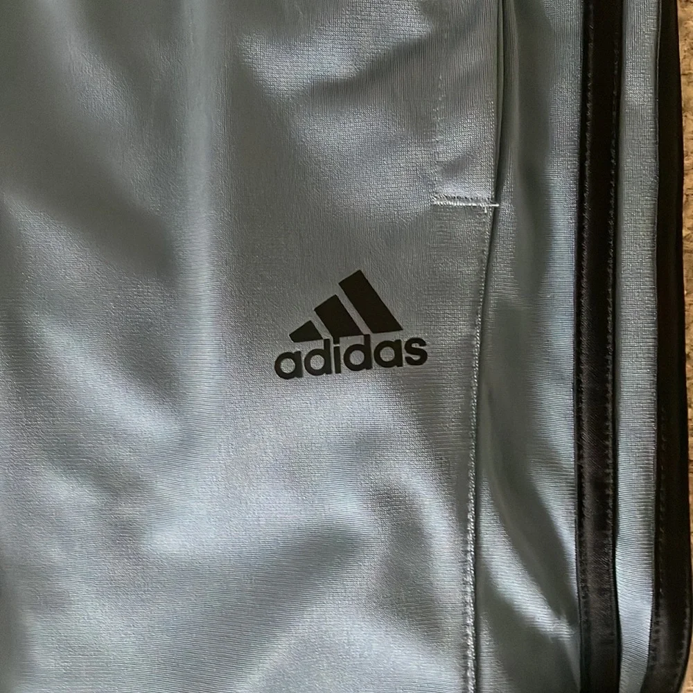 Adidas Men’s Joggers. Blue/grey color with black stripes.